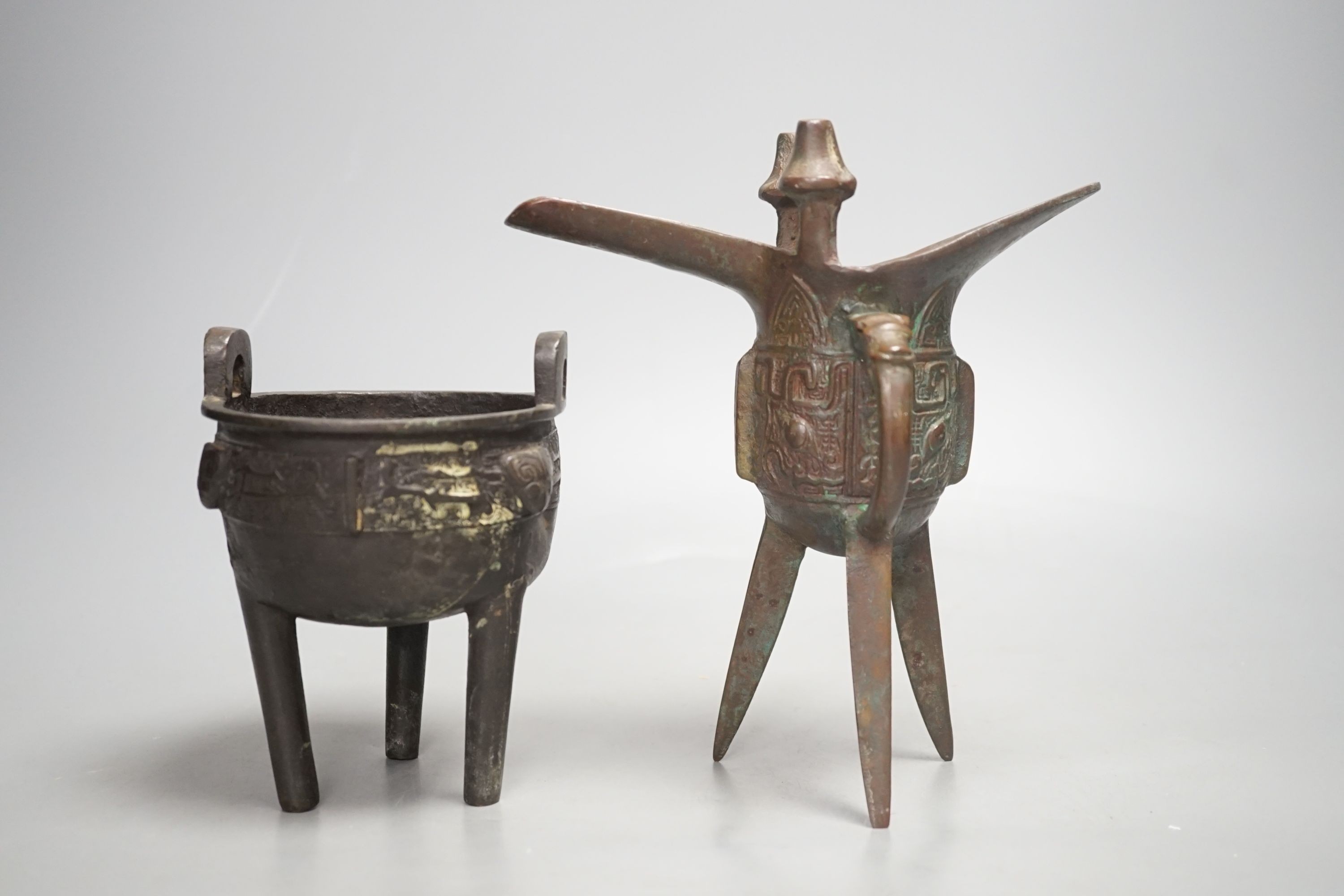 A Chinese bronze wine vessel and bronze tripod censer, wine vessel 19cms high